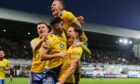 Dan O'Reilly is surrounded by Raith Rovers team-mates as they celebrate the winning goal in the Fife derby victory over Dunfermline Athletic. Image: Ewan Bootman / SNS Group.