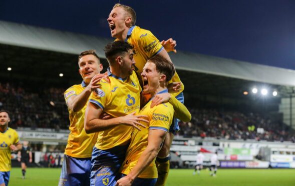 Dan O'Reilly is surrounded by Raith Rovers team-mates as they celebrate the winning goal in the Fife derby victory over Dunfermline Athletic. Image: Ewan Bootman / SNS Group.