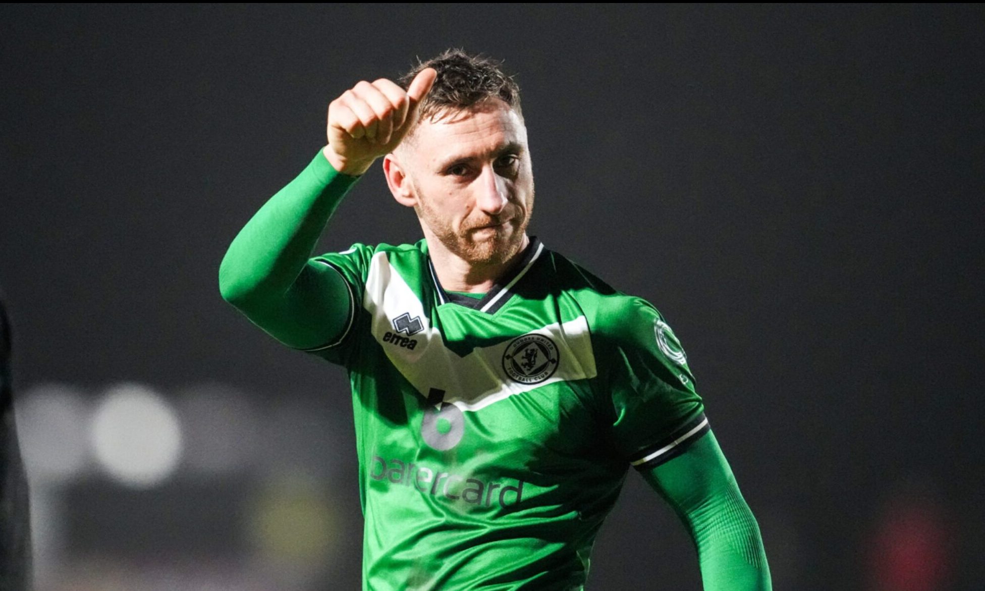Louis Moult takes the acclaim of more than 3,000 travelling Dundee United fans