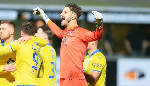 Raith Rovers keeper Kevin Dabrowski spreads his arms in celebration after winning the Fife derby against Dunfermline Athletic F.C.