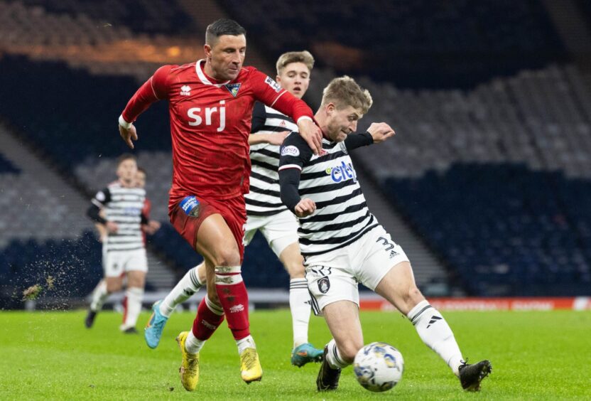 Dunfermline Athletic winger Michael O'Halloran is challenged by Queen's Park defender Tommy Robson. Image: Craig Foy / SNS Group.
