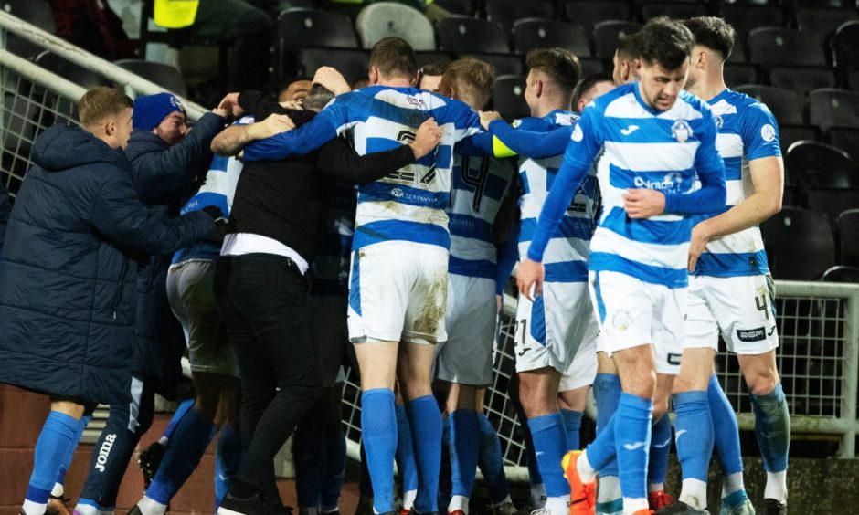 Morton players and staff celebrate a fine triumph at Dundee United