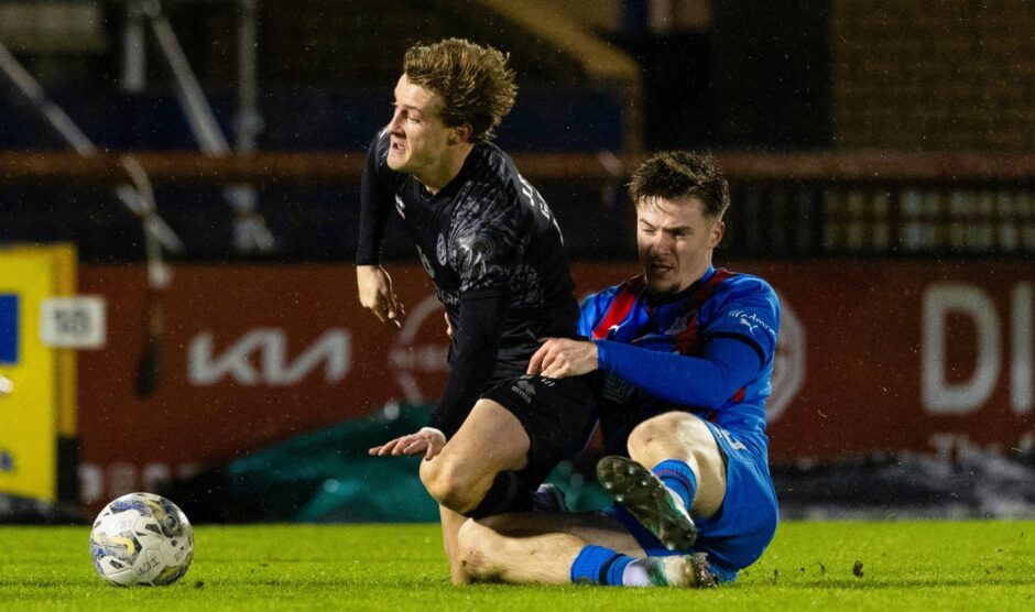 Alex Greive of Dundee United is challenged by Morgan Boyes of Inverness CT