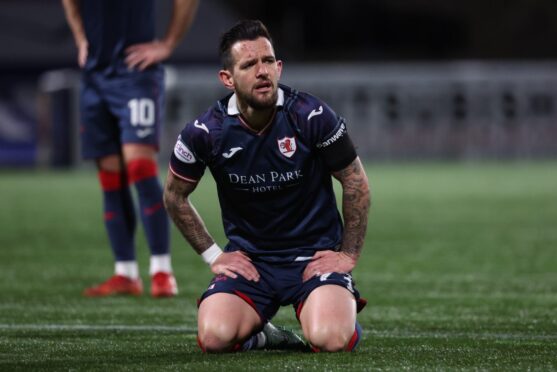 Dylan Easton kneels and looks dejected as Raith Rovers crash to defeat to Queens Park earlier in the season.
