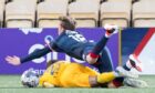 Raith Rovers' Kyle Turner bundles over Andrew Shinnie to give away a penalty during the Scottish Cup defeat to Livingston. Image: Sammy Turner / SNS Group.