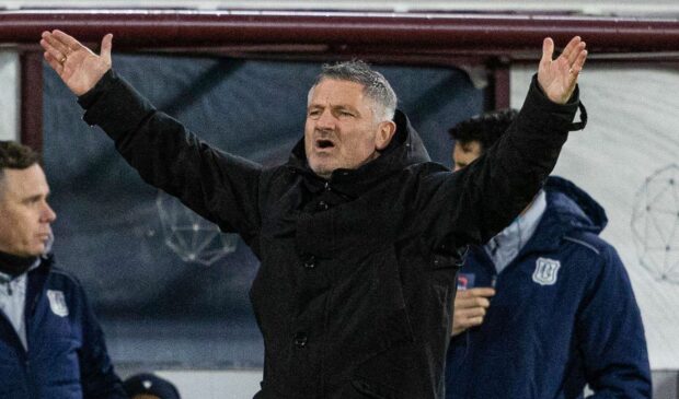 Tony Docherty watches on as his side fall to defeat at Hearts. Image: SNS