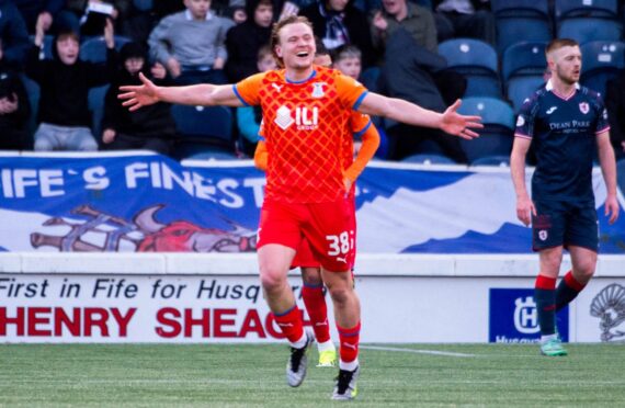 Alex Samuel runs away with his arms outstretched after completing his first-half hat-trick for Inverness Caley Thistle.