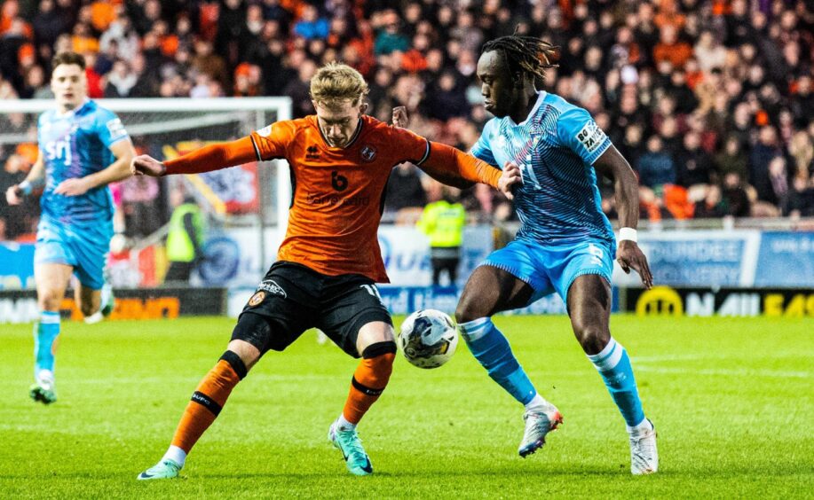 Ewan Otoo in close attention to Dundee United's Kai Fotheringham