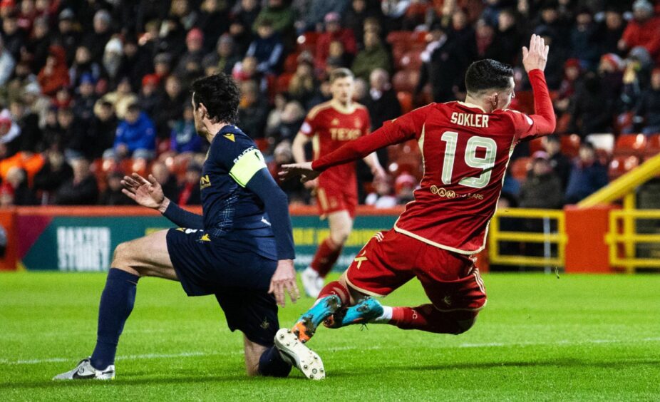 Joe Shaughnessy gives away a penalty at Pittodrie. Image: SNS