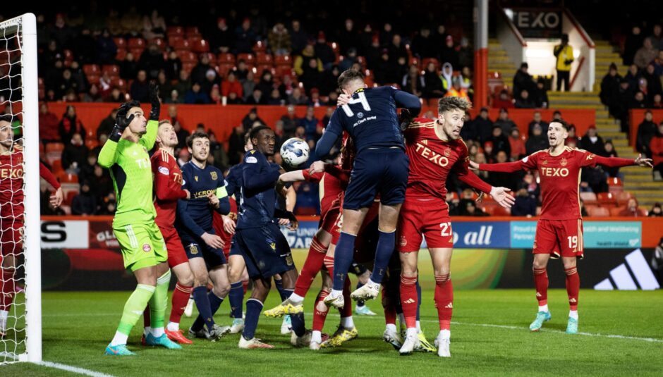 Lee Ashcroft rises highest at the far post to make it 1-1 for Dundee at Aberdeen. Image: SNS