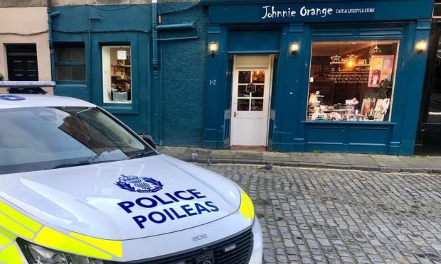 Police outside Johnnie Orange Cafe in Perth.