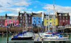 The yellow property at 2 Shore overlooks Arbroath harbour. Image: Harbour Haven