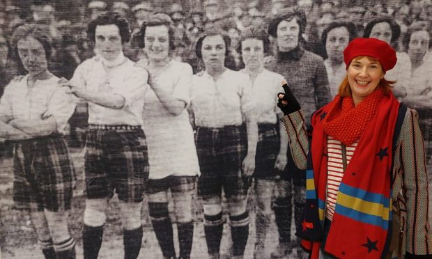 Kirkcaldy Galleries supervisor Carolyn Johnston points out her trailblazing great-granny in women's football exhibition