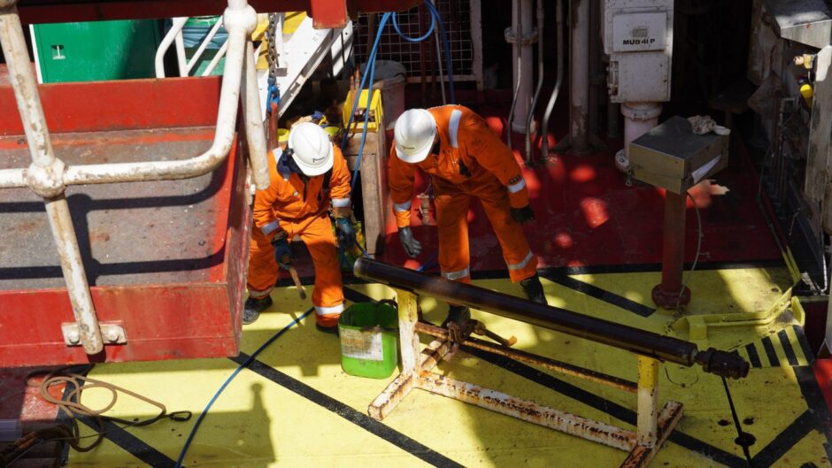 men work on floating wind farm