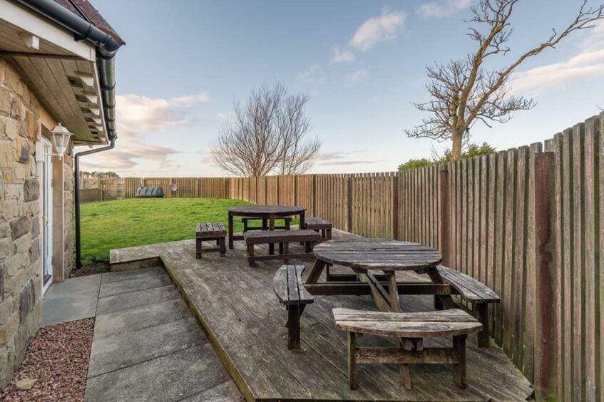 A decked area sits out the back of the Crail house