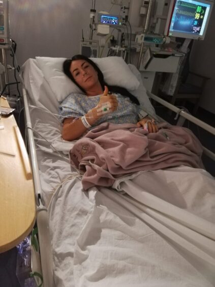 Emma recovering from her operation after she was diagnosed with cervical cancer. 