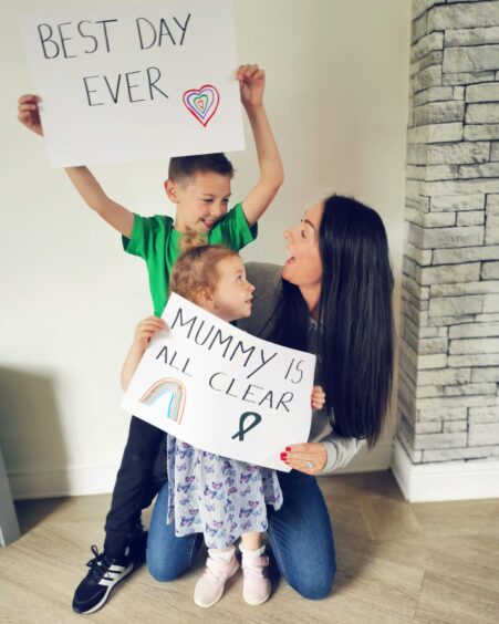 Emma Hutt received the all-clear from cervical cancer in August 2020. She is pictured with children Brody and Bonnie.