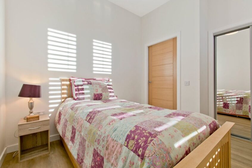 Both bedrooms feature fitted wardrobes.