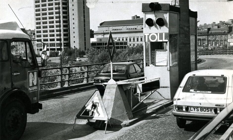 a car going past the Tay Road Bridge toll booths in 1980.