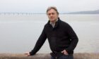 Ian Redford poses by the River Tay in Dundee in 2013 after releasing his autobiography.