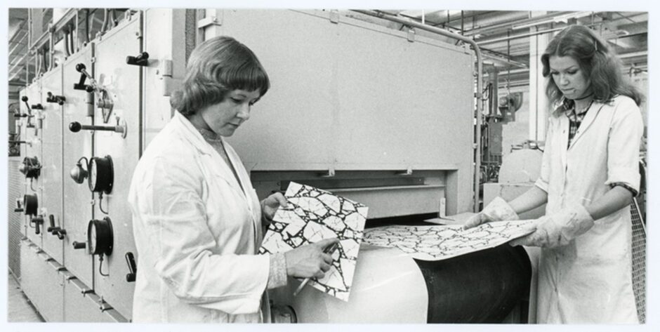 Agnes Lawrie and Fiona Alexander (Fiona Campbell) examining printed floorcovering at the Research and Development block, Nairn's, Kirkcaldy.
