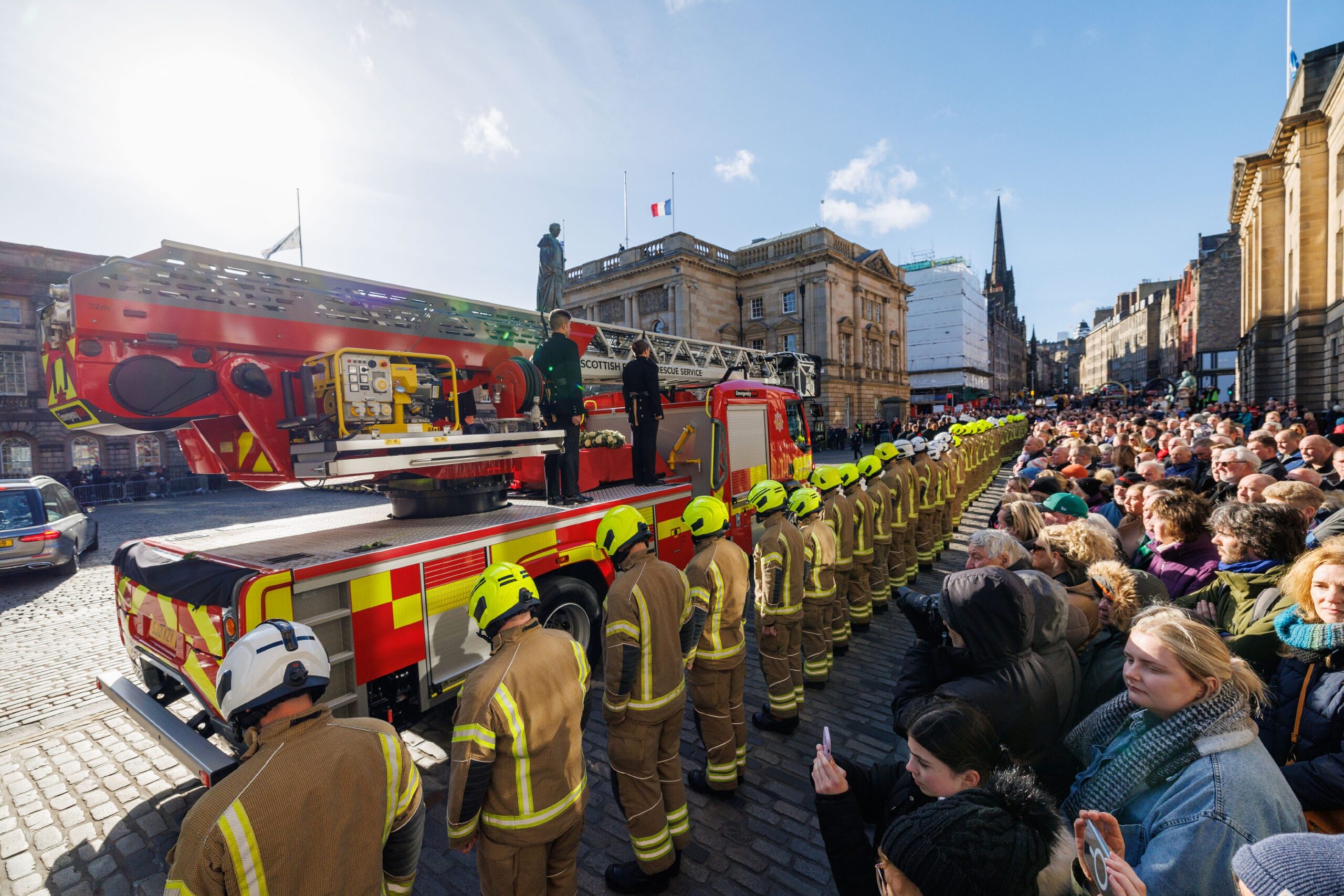 Firefighters line the streets for Barry Martin's funeral cortege.