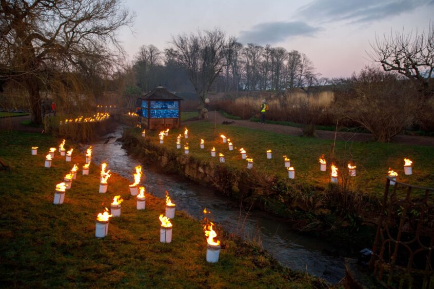 120 fire candles lit up the Burn at Cambo Gardens.