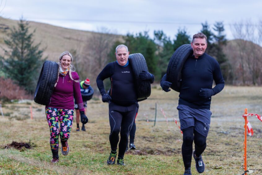 Competitors had to carry a tyre around the MacTuff course. 