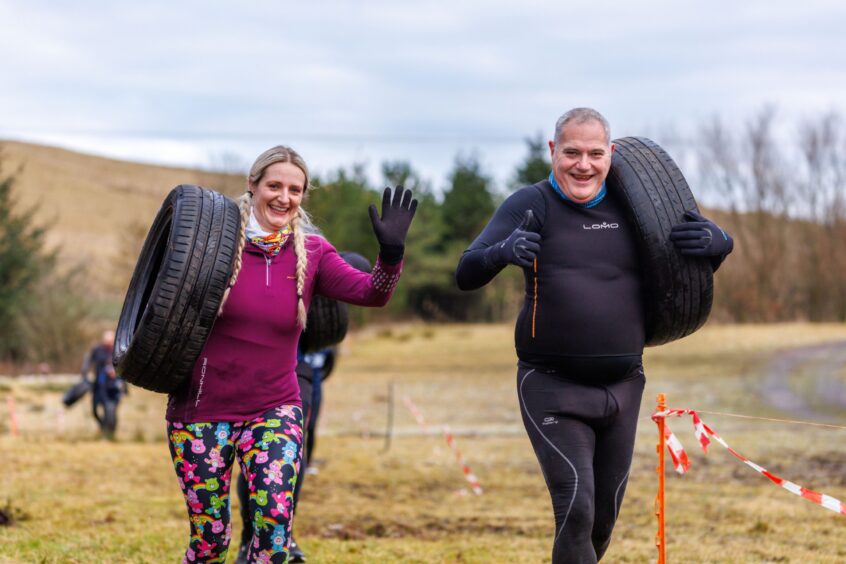 A couple of competitors still have time to smile.