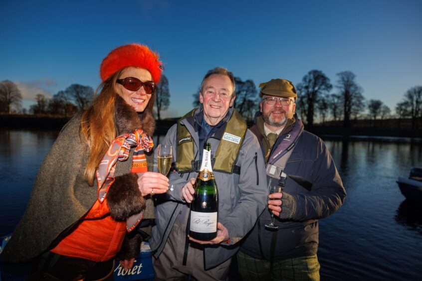 Claire Mercer Nairne with Paul Whitehouse and head ghillie Calum McRoberts on the banks of the Tay at Meikleour. Image: Kenny Smith.