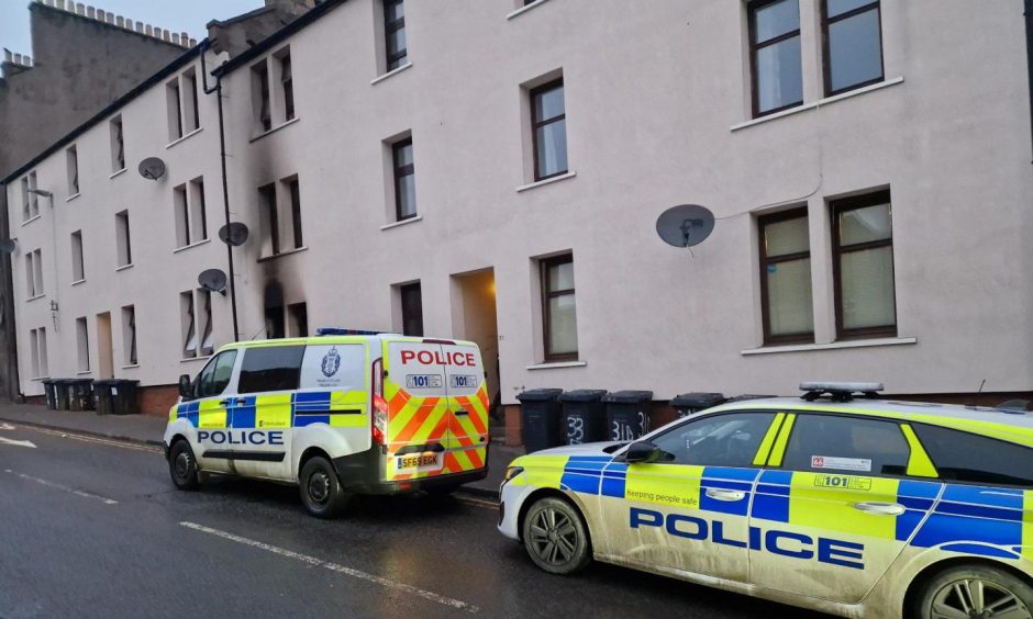 Police outside Kinghorne road flat after Dundee fire