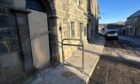 The frame blocking the pavement outside the Old Town House in Inverkeithing.