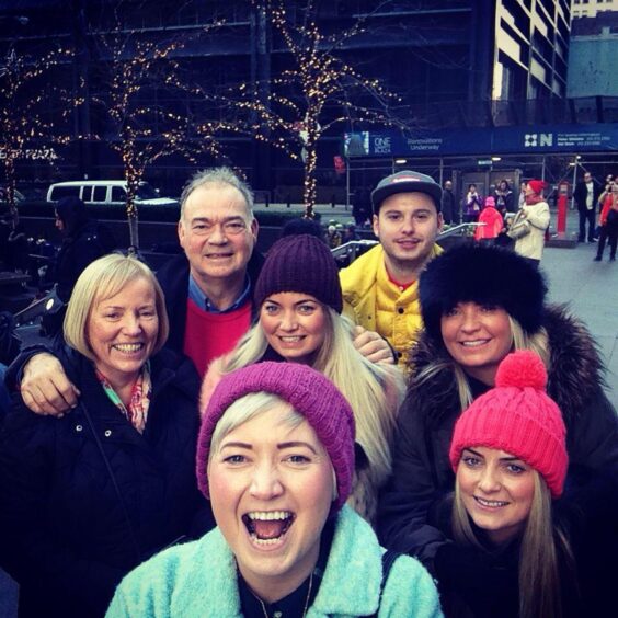 Rachel pictured with her three sisters, mum, dad and husband Adam.