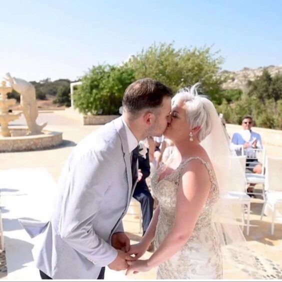 Rachel and Adam Coats on their wedding day in Cyprus.