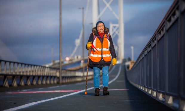 Dr Lynne Tammi-Connelly on her 'Long Walk for Justice' across the old Forth Road Bridge, en route from Montrose to Edinburgh. Image: Steve MacDougall/DC Thomson