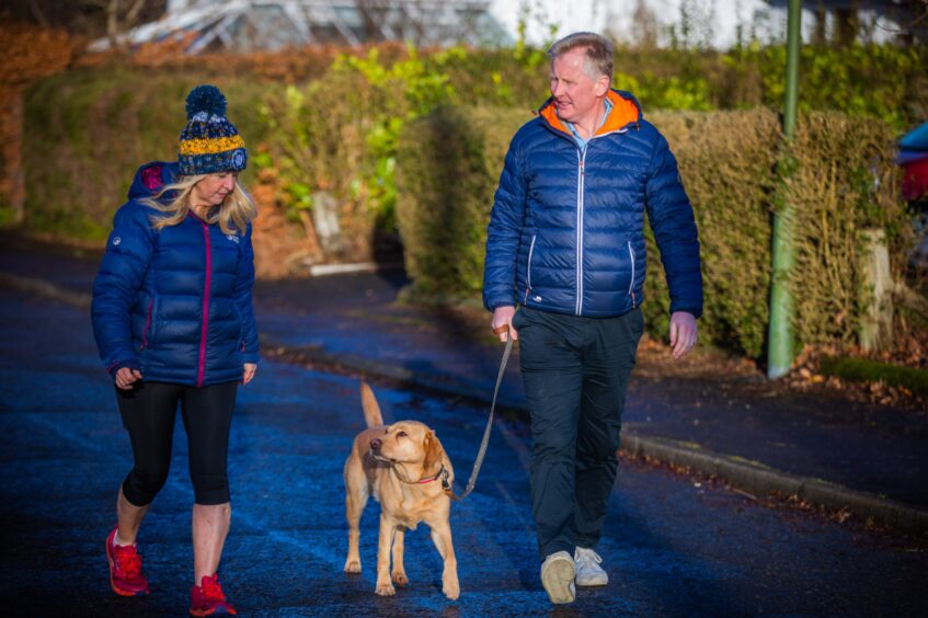 Ian and wife Sandra Beattie out walking their dog Molly.