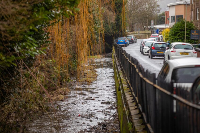 Craigie Burn with road and cars beside