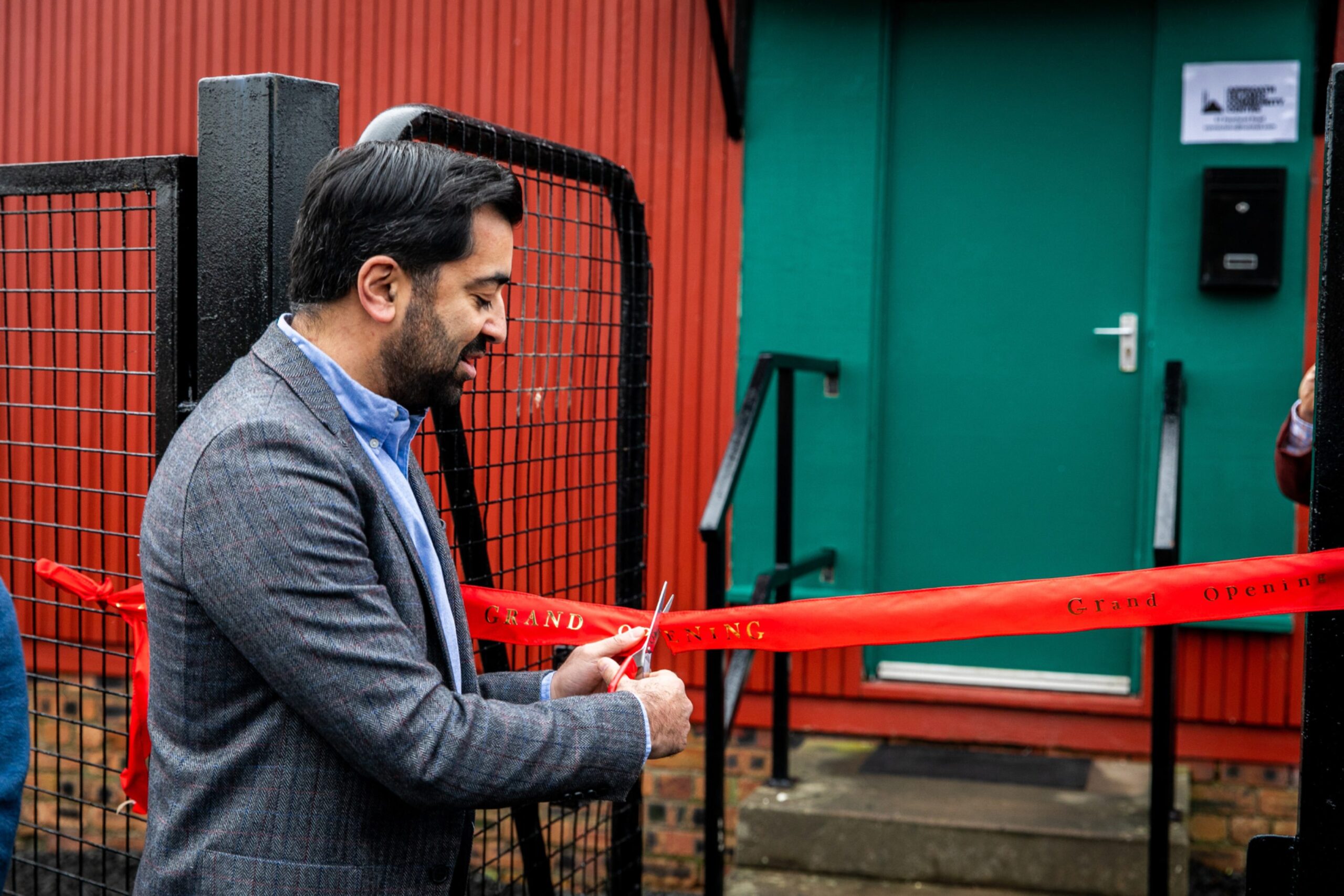 Humza Yousaf cutting the opening ribbon.