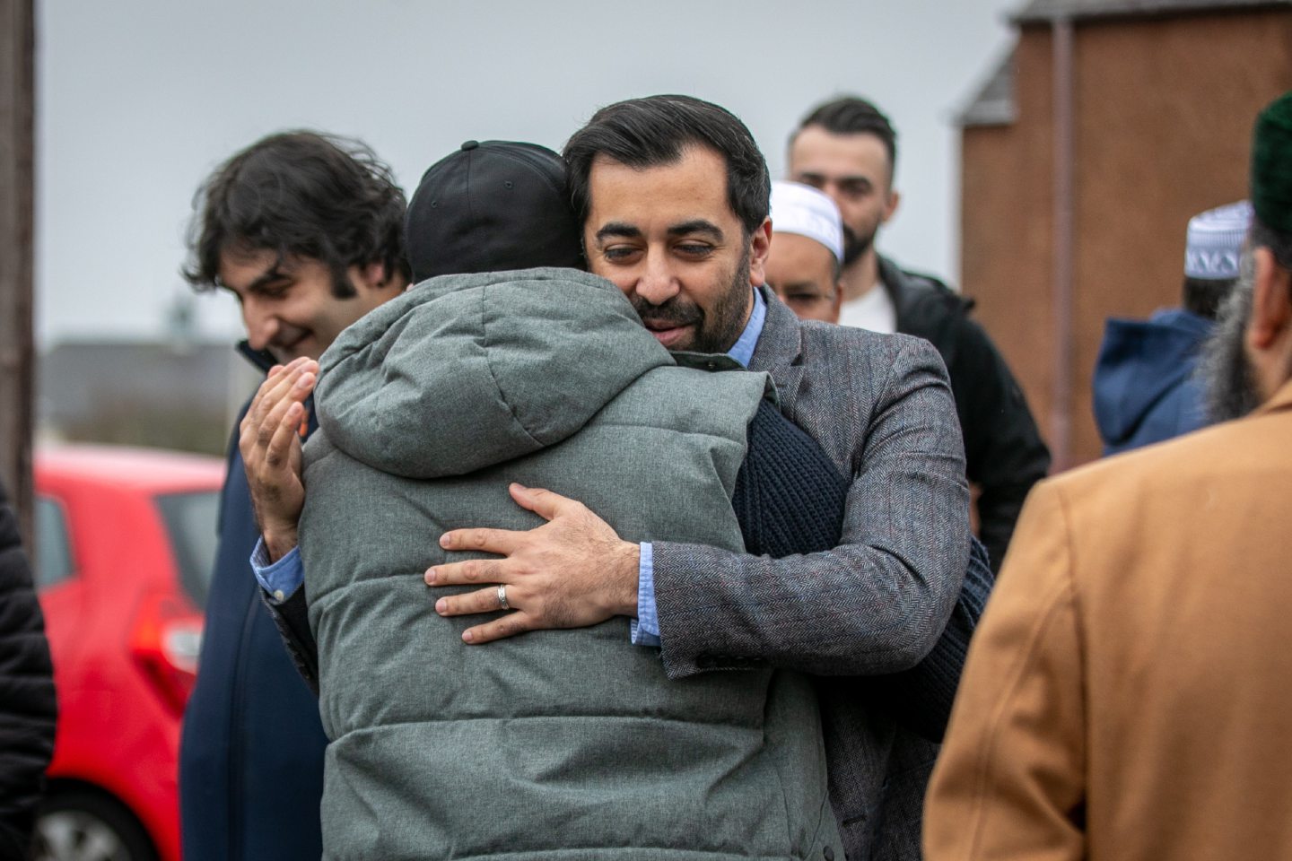 Humza Yousaf hugging an attendee at the event.