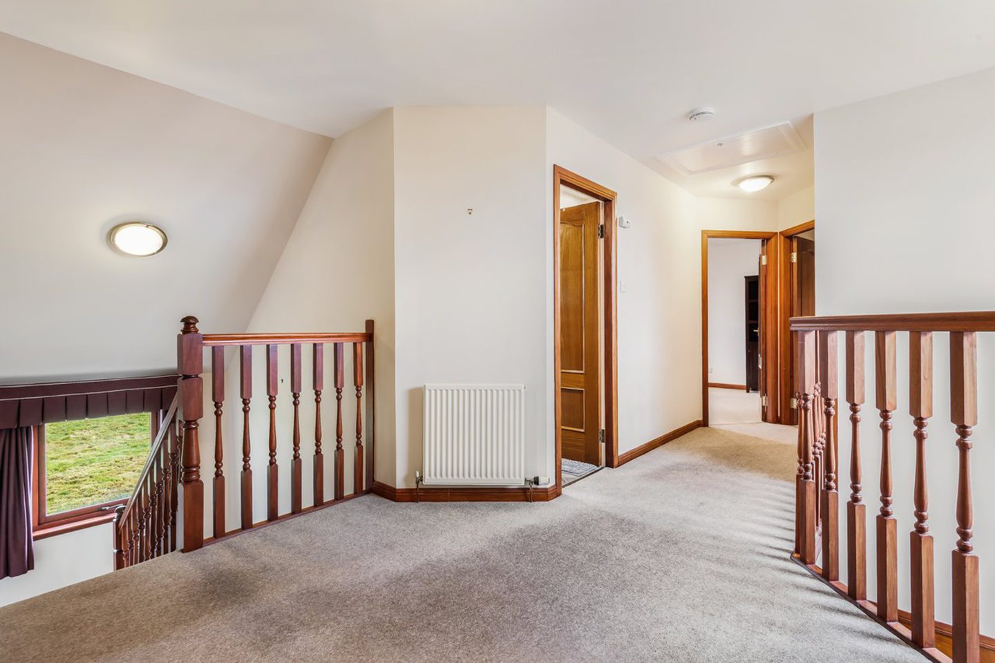 The upstairs landing leads to the four top floor bedrooms.
