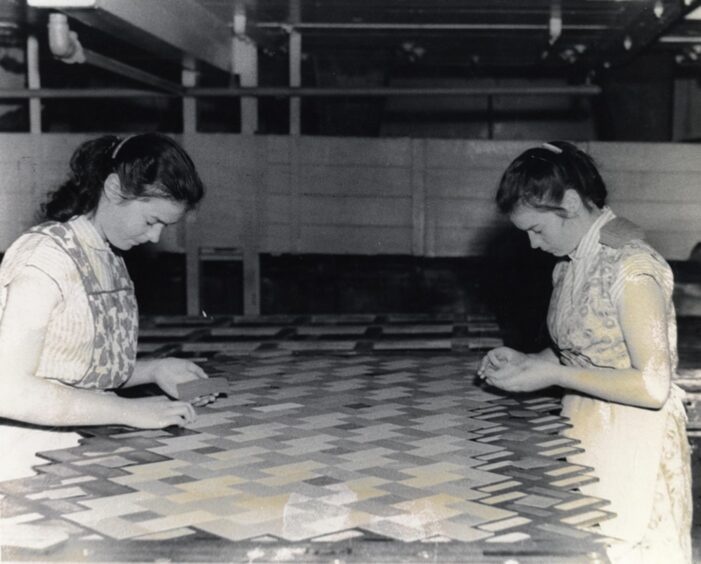 Catherine and Janet Fotheringham making inlaid linoleum.