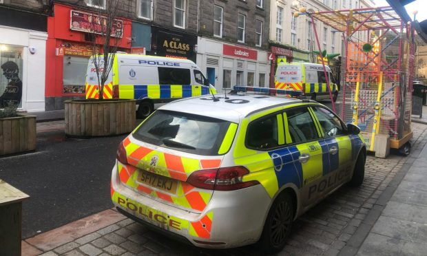 Police on Union Street, Dundee, as part of the missing man search on Tuesday. Image: James Simpson/DC Thomson