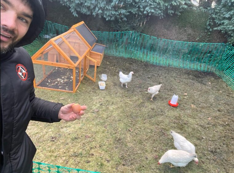 Dundee United striker Tony Watt and his chickens