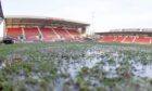 Water lies on the pitch at East End Park. Image: Craig Brown / DAFC.