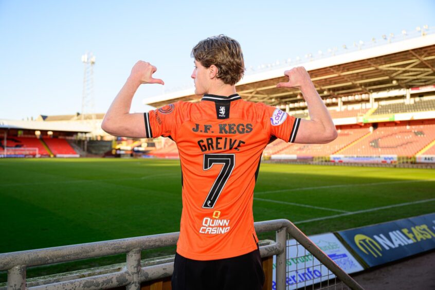Dundee United striker Alex Greive points to his No.7 shirt