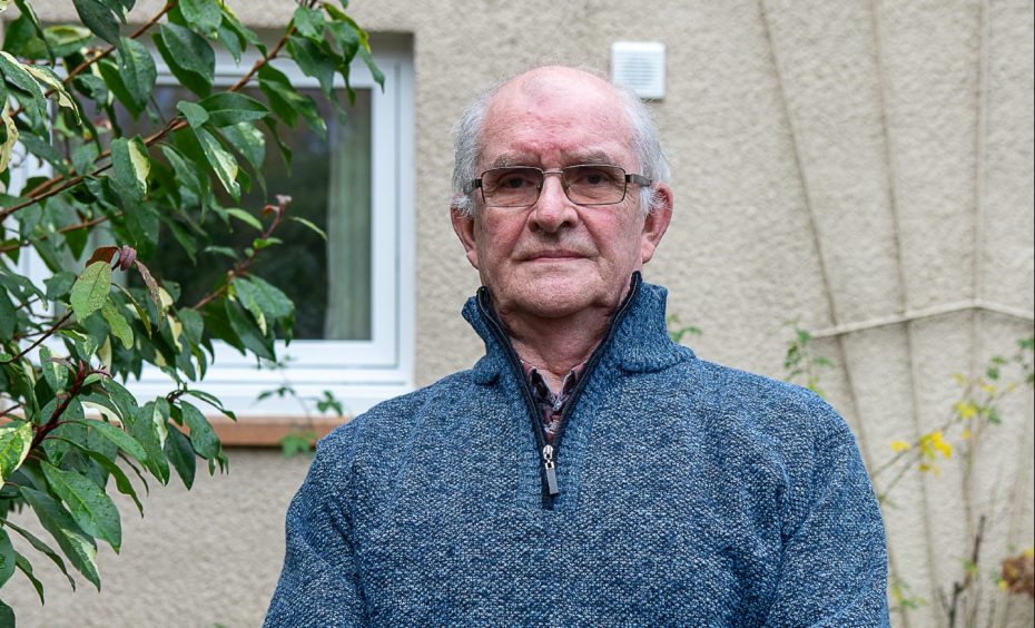 Norman Hawkes standing outside his Pitlochry home