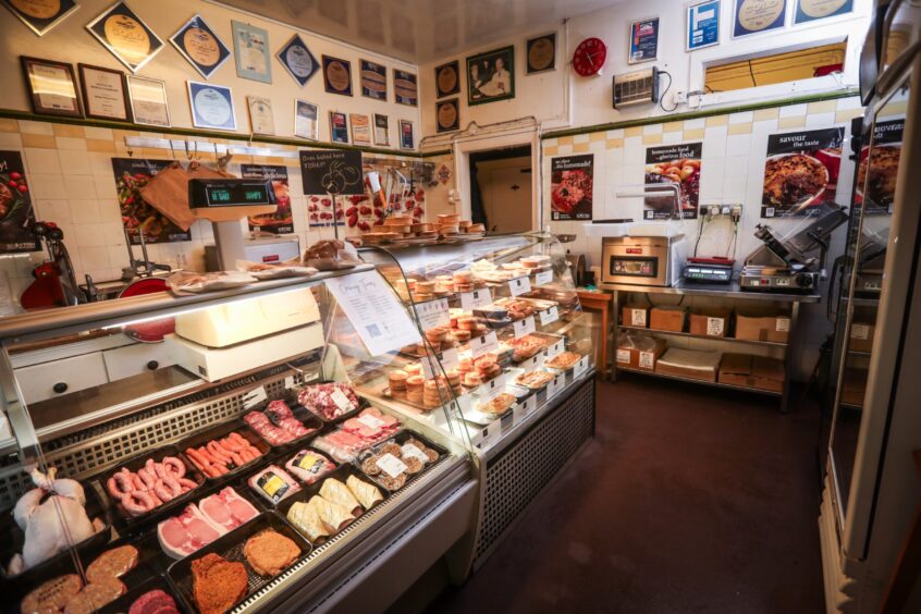 James Pirie and Son interior. A traditional butcher shop showing rows of pies, pastry products and butcher meat