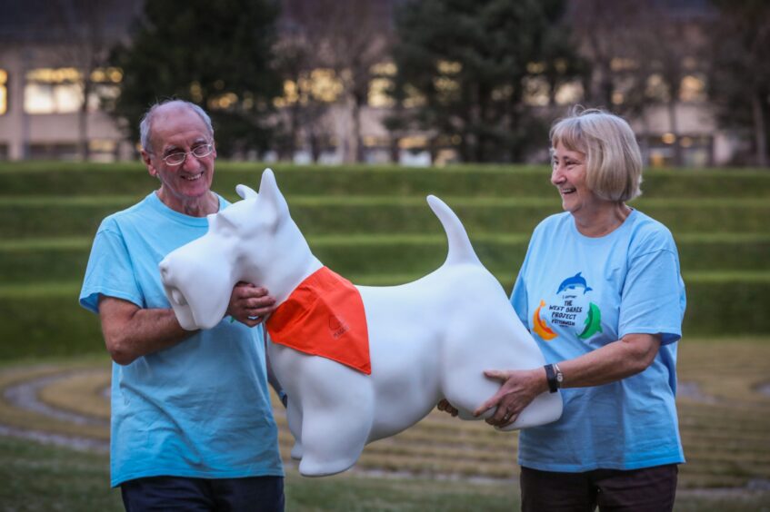 West Braes Project and Tidal Pool trustees Bill Porteous and Lynne Steen with the Wee Scottie Dug