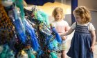 Two kids looking at ocean-themed Dundee Science Festival exhibit
