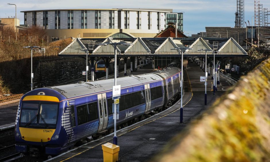 A ScotRail train at the bend at Dundee railway station.